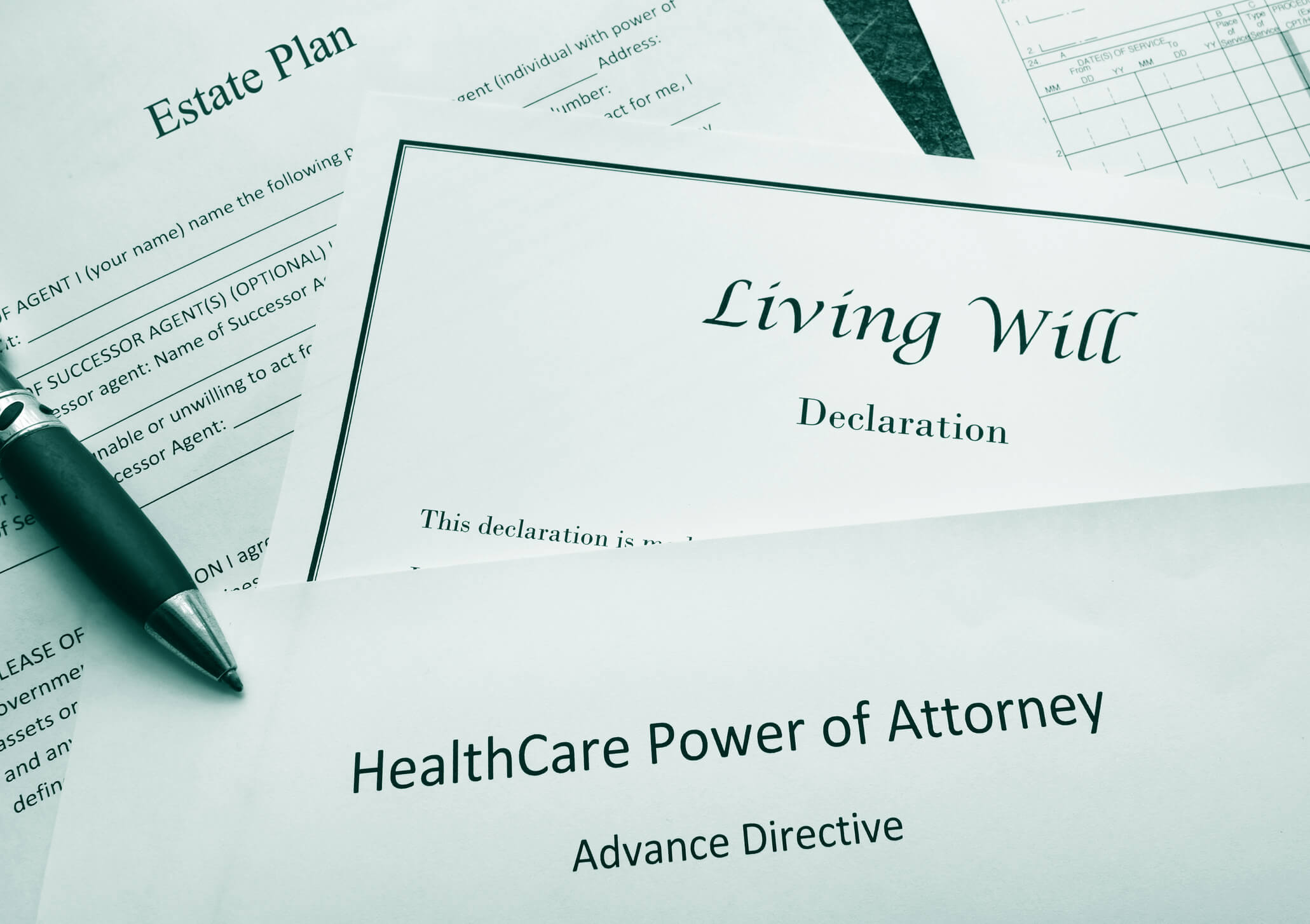 Signing a living will and power of attorney documents.