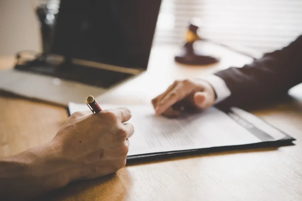 An attorney and client discussing estate paperwork.