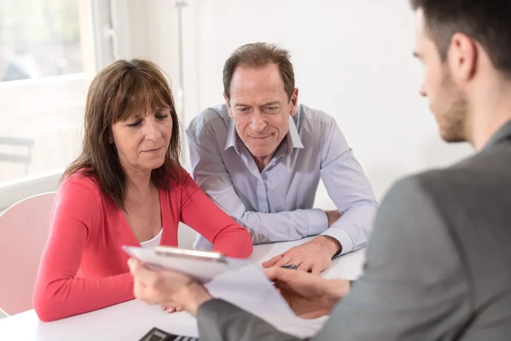 An elderly couple meeting with a probate lawyer.
